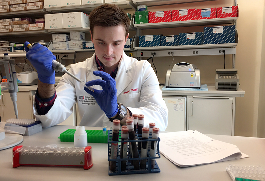 Gregory Roloff '12 at the NIH testing a sample.