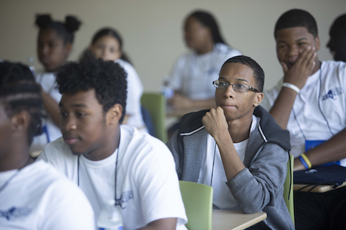 Student in Camp College listens during a session.