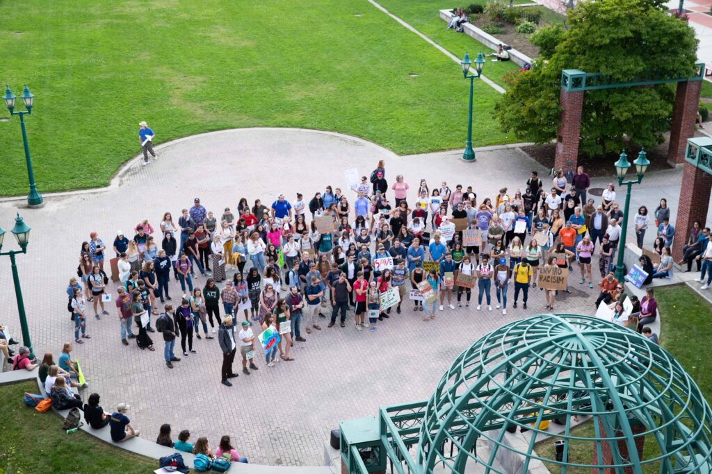 Campus community members gather at the ISC during a climate change rally.