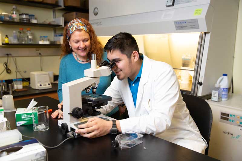 Nolberto Jaramillo Jr. '21 and associate professor of biology Jani Lewis