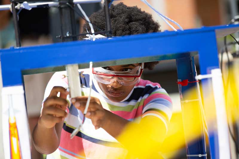 student working on summer research project in physics