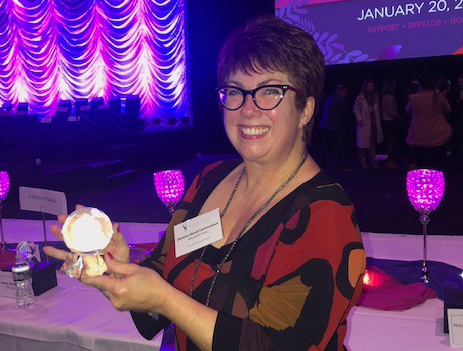 Denise RL Denise Reed Lamoreaux with her ATHENA globe