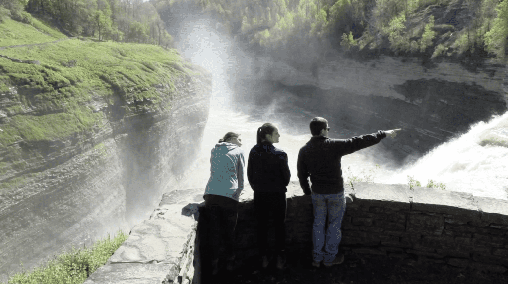 Pointing at waterfall in Letchworth State Park