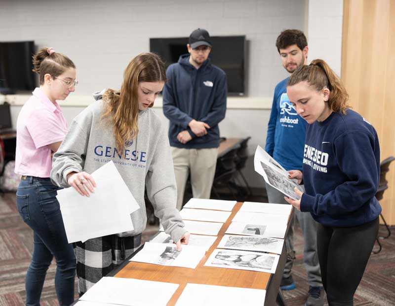 students laying out journal pages