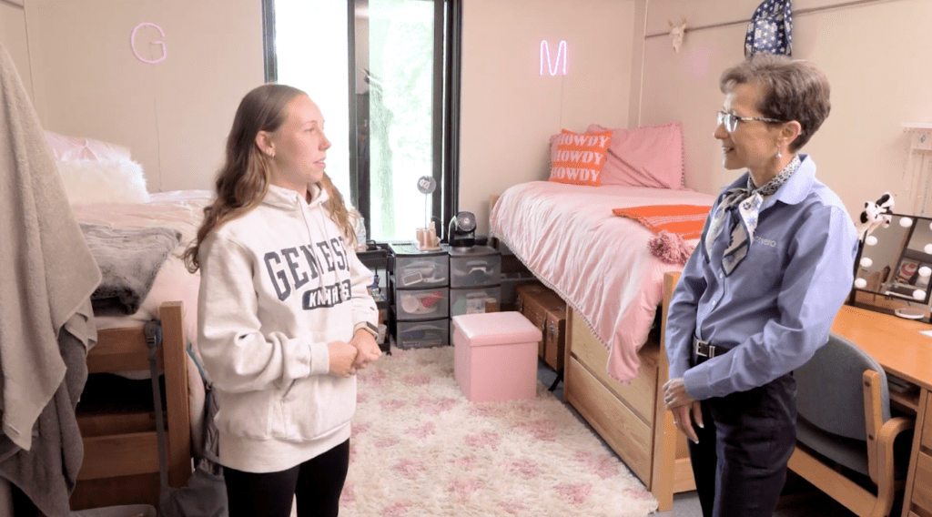 President  Battles speaks to Greta Recktenwald '26 in her residence hall.