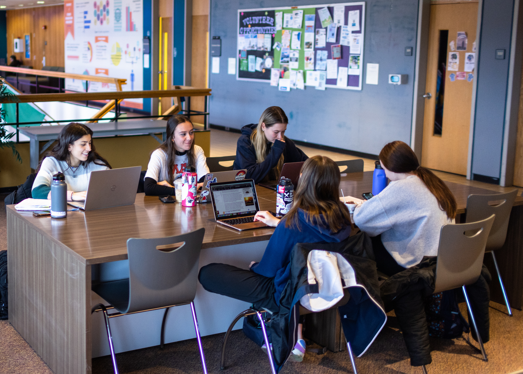 Students study at a table in the Union