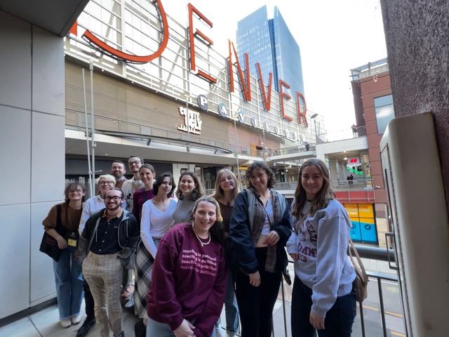 Sigma Tau Delta students gather to take a photo in Denver