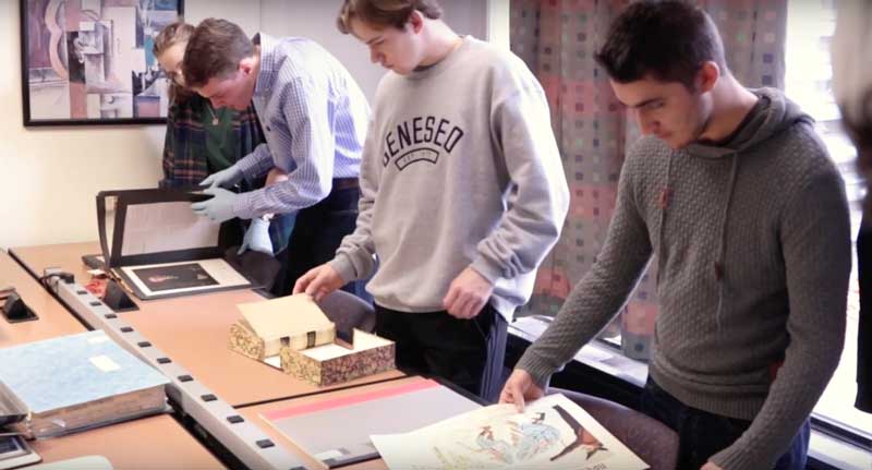history students working with Special Collections material