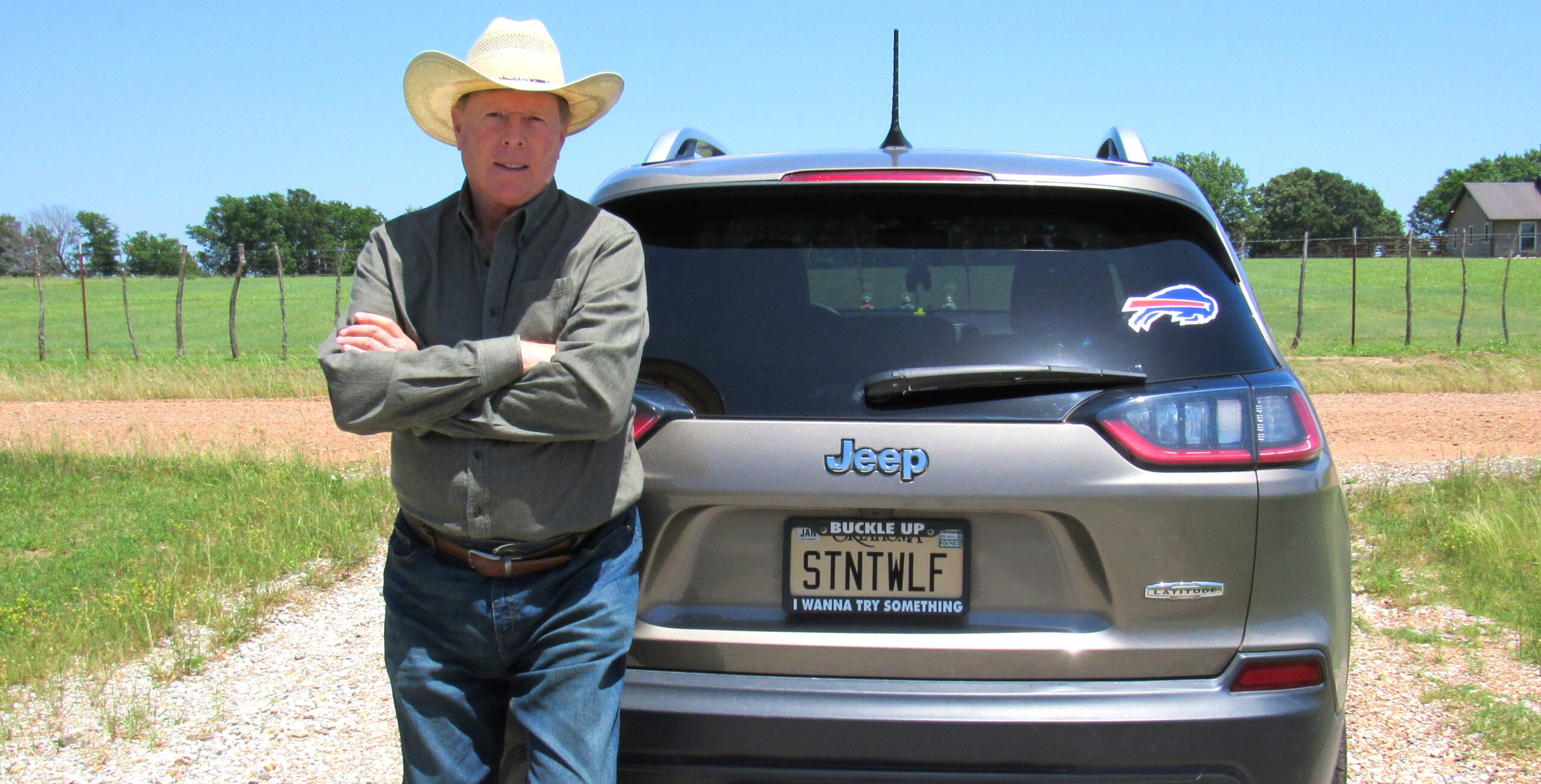 Brian Hossenlopp-Dakota ’77 in front of a car.